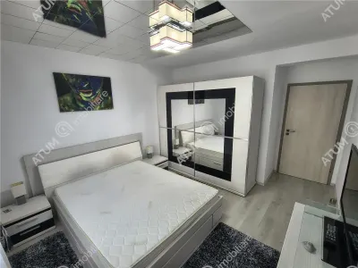 De inchiriat apartament modern la etajul 1 cu 2 camere decomandate, balcon si loc de parcare privat in Sibiu - foto 4
